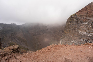 Vesuvius Crater in the clouds in cloudy weather, Italy