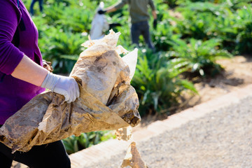 People cleaning the nature of garbage and pollution of plastic bottles.