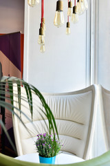 Nice corner to read from a house with natural lighting from a window.