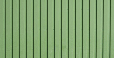 Naklejka premium Green background of metal wall siding, cladding.