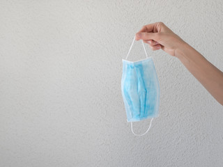Medical bandage in hand on a white background. Virus protection concept