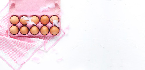 Eggs in a box on a white background. Easter concept. Delicate colors and plenty of room for text. Copy space