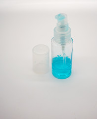 Coronavirus hand sanitizer gel to wash hands for flu virus prevention. Blue gel in clear plastic bag on white