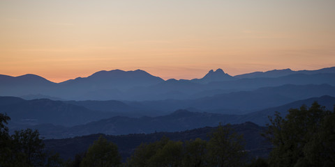 Mountain landscape with orange sky.