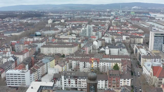 Aerial / drone panorama top rotating cinematic shot of Mainz and the christus church at the kaiserstraße in mainz with the river rhine in the background 30p