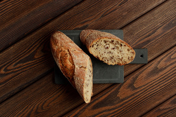 Freshly baked traditional bread on wooden table