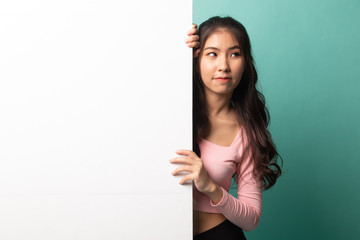 Young Asian woman with blank sign.