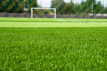 Artificial green grass on the football field