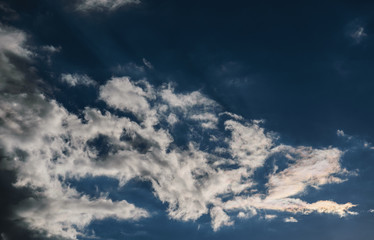 Naklejka na ściany i meble Blue sky with dark clouds. Nature background.