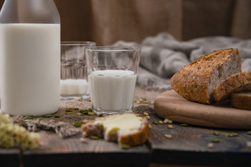 Rustic breakfast with milk and bread. World Milk Day on the first of June. Horizontal shot.