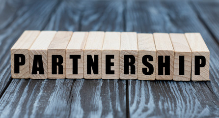 concept word PARTNERSHIP on cubes on a beautiful gray blue background