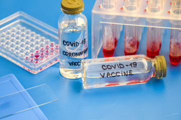 Healthcare cure concept with a hand in blue medical gloves holding Coronavirus, Covid 19 virus,...