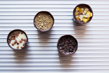 Various of sweet confectionery with chocolate candies and pralines. Handmade box of chocolates. Realistic chocolate set, delicious dessert pattern.