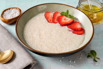 Vegan tapioca pudding in a plate on light blue background
