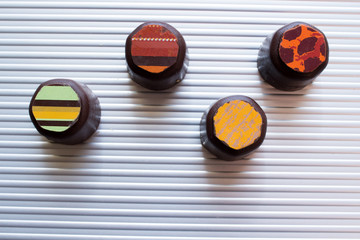 Various of sweet confectionery with chocolate candies and pralines. Handmade box of chocolates. Realistic chocolate set, delicious dessert pattern.