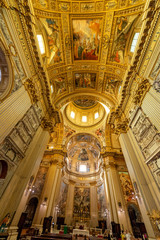 Fototapeta na wymiar ROME, ITALY - May 2, 2015: The nave of baroque church Basilica di Sant Andrea della Valle. Famous basilica, Piazza Vidoni, built in Baroque style, 1608 AD. Church interior with reflection.