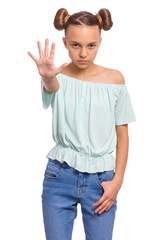 Portrait of teen girl doing stop sign with palm of hand, isolated on white background. Caucasian teenager making stop gesture with negative and serious facial expression. Angry child looking at camera