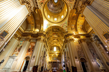 ROME, ITALY - May 2, 2015: The nave of baroque church Basilica di Sant Andrea della Valle. Famous basilica, Piazza Vidoni, built in Baroque style, 1608 AD. Church interior with reflection.