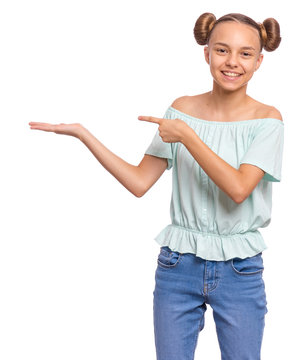 Portrait Of Teen Girl Pointing Hands Away At Copyspace, Isolated On White Background. Beautiful Caucasian Young Teenager Smiling And Attracted By Attention Pointing Finger At Something. Happy Child.