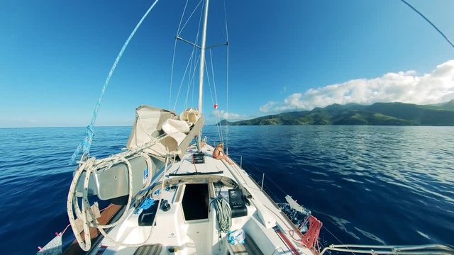Sea coastline in a first-person view from a sailing boat. Summer sea holiday vacations.