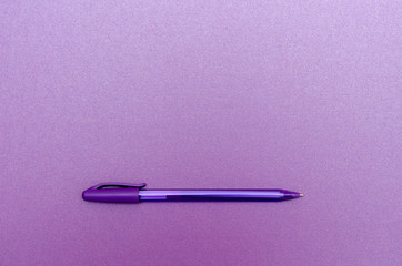 Pen on blank purple textured paper