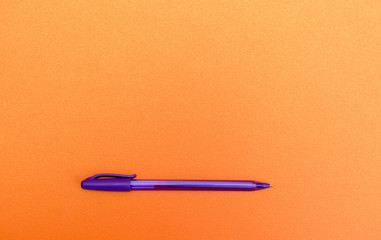 Pen on blank orange textured paper