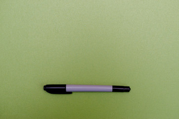 Color marker on blank green textured paper