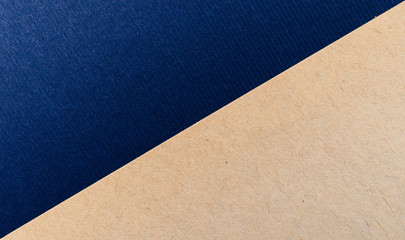 Fototapeta premium Blue and kraft paper texture background. Place for text. Two tones. Background for presentation.