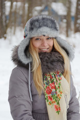 winter portrait of a beautiful girl in a hat