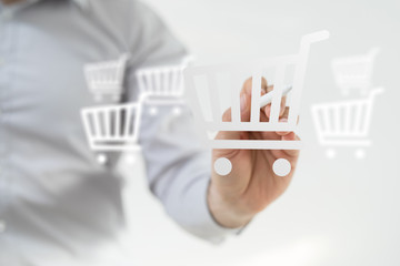 Businessman pressing modern technology panel shopping cart web phone credit card.