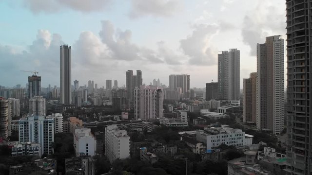 Aerial view through Mumbai City, Beautiful cloudy weather, 4k