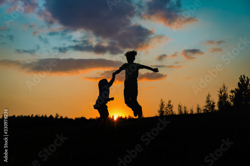 Silhouette Of Happy Boy And Girl Enjoy Sunset Nature Wall Mural Wallpaper Murals Nadezhda1906