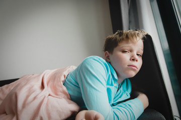 Fototapeta premium Sick child with infection or virus at home, self isolation