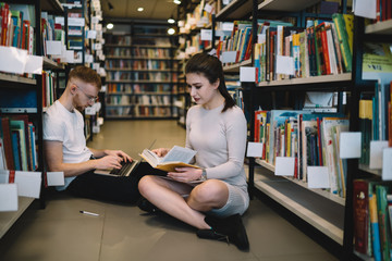 Modern students learning in library together