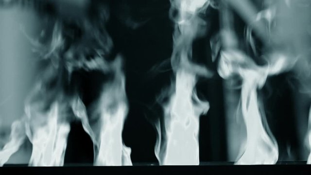 Artificial electrofireplace glowing backlight close-up.