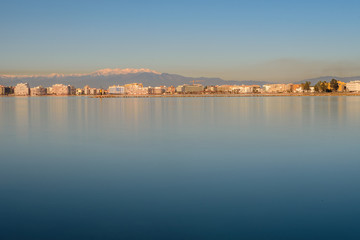 Naklejka premium ROSES, SPAIN - jan 24 2018 : Beach and city view of mediterranean town Roses. jan 24 2018 in Catalonia, Spain