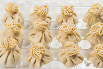 Khinkali on white background.