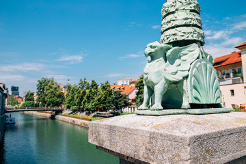 Fototapeta na wymiar Ljubljana symbol dragon sculpture at Dragon Bridge Zmajski most in Ljubljana, Slovenia