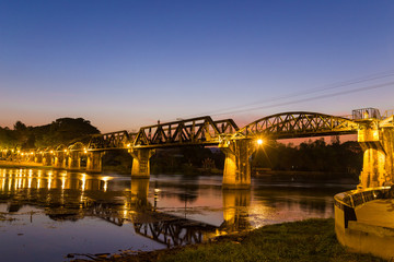 Fototapeta na wymiar The Bridge on the River Kwai Built during World War II. Is an important place and a destination for tourists from around the world. Twilight time