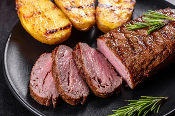 Ribeye steak with potatoes, onions and cherry tomatoes