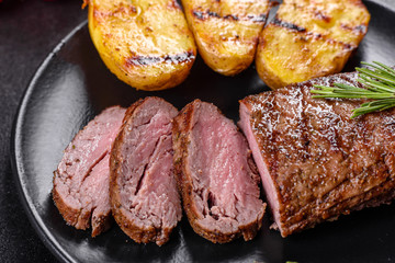 Ribeye steak with potatoes, onions and cherry tomatoes