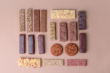 Row of mixed gluten free granola cereal energy bar with dried fruit & various nuts and protein...