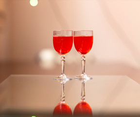 Everything prepared for a party, glasses, masks, lights and fruit with their reflections.