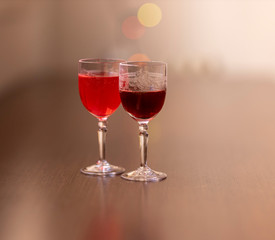 Everything prepared for a party, glasses, masks, lights and fruit with their reflections.