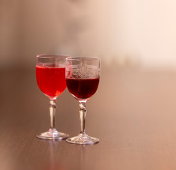 Everything prepared for a party, glasses, masks, lights and fruit with their reflections.