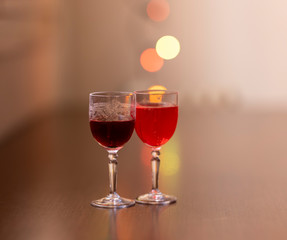 Everything prepared for a party, glasses, masks, lights and fruit with their reflections.