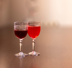 Everything prepared for a party, glasses, masks, lights and fruit with their reflections.