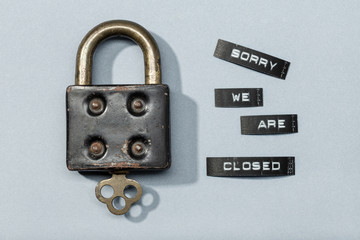 Padlock with label sorry we are closed isolated on gray background. Closed by coronavirus or covid-19 concept