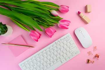 Woman's work place on pink background flat lay. Remote distant home office above, lockdown...