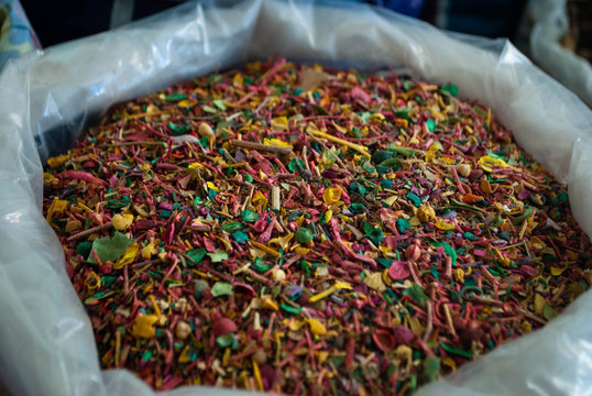 Close-up of Atil Batil (Peganum harmala) in a white bag in a local street market in the village. Dried herbs and spices shop. Herbs for medical treatment. Exploring villages of Azerbaijan